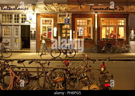 bicycles in front of inn Kulturkneipe, Muenster Stock Photo