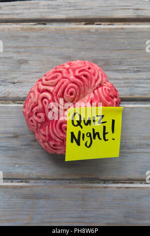 Quiz night label stuck on a brain Stock Photo