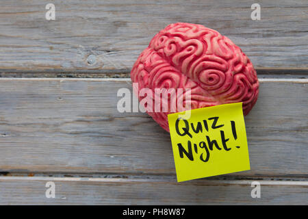 Quiz night label stuck on a brain Stock Photo