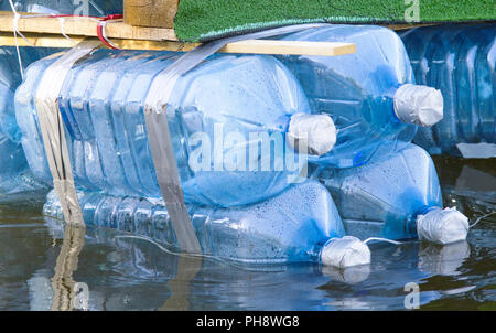 rafts made of recycled plastic bottels to teach reuse Stock Photo