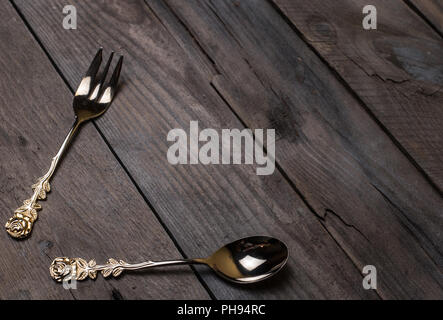 vintage forks and spoons on old wooden boards Stock Photo