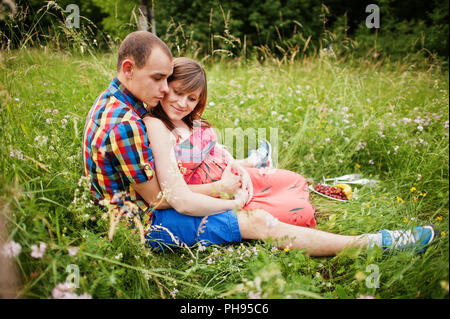 Happy young couple expecting baby, pregnant woman with husband Stock Photo