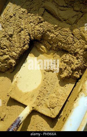 Wet ready-mix Concrete  Sand and Cement with spade in a container Stock Photo