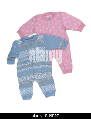 Two knitted pink and blue rompers. Stock Photo