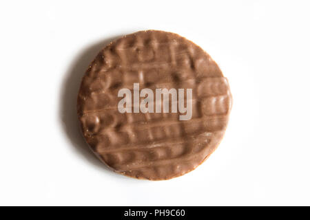 Half covered milk chocolate digestive biscuit on it's own on a white background with a small shadow to the left hand side of the biscuit Stock Photo