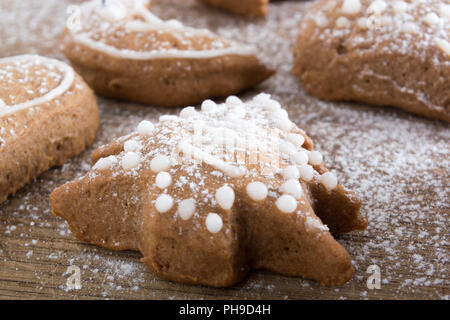 Gingerbread cookies on plate covered with sugar Stock Photo