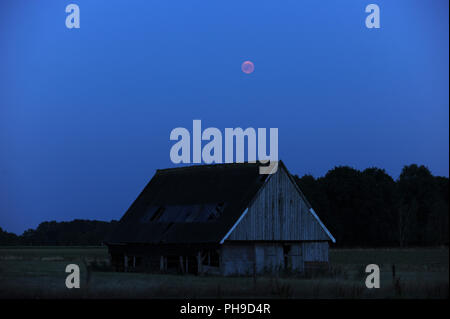 The lunar eclipse of 07-27-2018 as seen in the countryside in the Netherlands Stock Photo