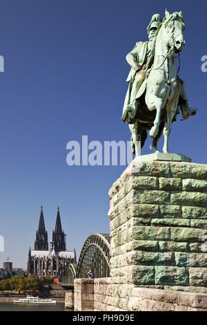Equestrian Statue of Wilhelm I. with Cologne Cathedral and Hohenzollern Bridge, Cologne, Germany Stock Photo