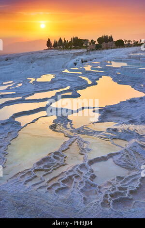 Pamukkale limestone terraces at sunset time, Pamukkale, Turkey Stock Photo