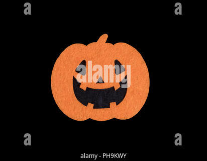 Bright scary pumpkin decoration isolated on black background Stock Photo