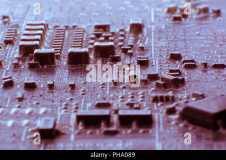 Surface-mount dusty smd components on used electronic circuit board.