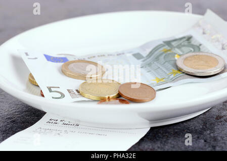 Tip on a restaurant table Stock Photo