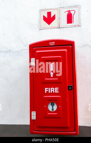 A Close up view of a red fire extinguishes box incase of a fire Stock Photo