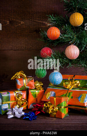 Many Christmas presents under the tree and decorations Stock Photo