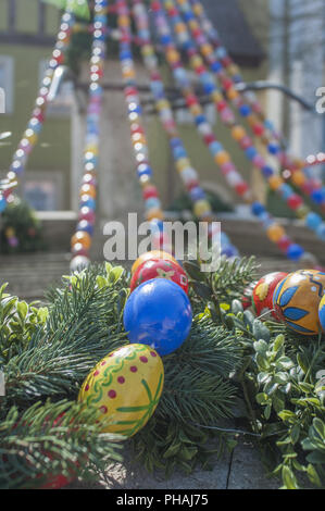 Decorated Water well with easter eggs in Langenburg, Germany Stock Photo