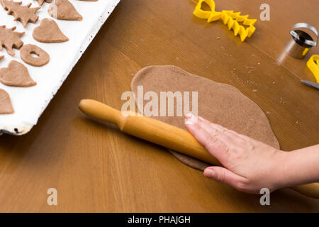 Christmas cookies dough on baking sheet Stock Photo