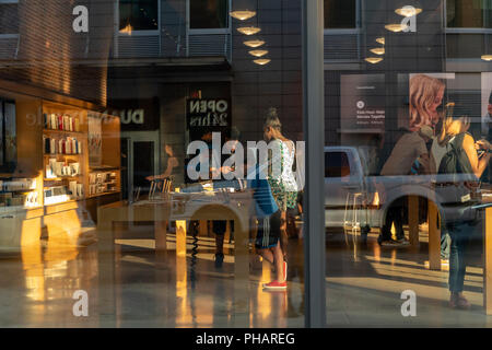 Customers in the Apple store in the Williamsburg neighborhood of Brooklyn in New York on Tuesday, August 28, 2018. (© Richard B. Levine) Stock Photo