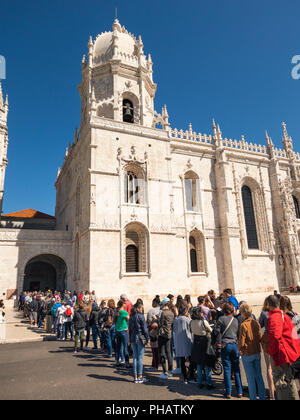 Portugal, Lisbon, Belem, Monastario dos Jeronimos, Monastery, queue of visitors at door waiting to enter Stock Photo