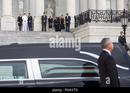 August 31, 2018 - Washington, District of Columbia, U.S. - Members of the McCain family (top) watch joint service members of a military casket team prepare to carry the casket of Senator John McCain into the US Capitol, where he will lie in state for the rest of the day in Washington, DC, USA, 31 August 2018. McCain died 25 August, 2018 from brain cancer at his ranch in Sedona, Arizona, USA. He was a veteran of the Vietnam War, served two terms in the US House of Representatives, and was elected to five terms in the US Senate. McCain also ran for president twice, and was the Republican nominee Stock Photo
