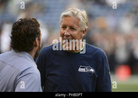 Seattle, Washington, USA. 30th Aug, 2018. Seahawk Head Coach PETE CARROLL talks with GM JOHN SCHNEIDER during pregame warmups as the Oakland Raiders play the Seattle Seahawks in a preseason NFL game at Century Link Field in Seattle, WA. Credit: Jeff Halstead/ZUMA Wire/Alamy Live News Stock Photo