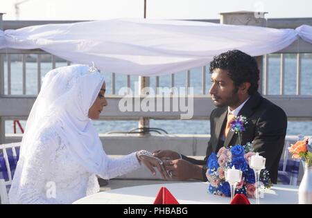 Male. 31st Aug, 2018. A Maldivian couple attend a mass wedding