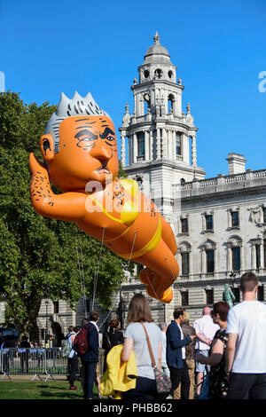 London, UK.  1 September 2018.  A 29 foot giant balloon depicting Sadiq Khan, Mayor of London, wearing a yellow bikini, flies over Parliament Square.  Activist Yanny Bruere raised £58,000 to fly the balloon in protest at the Mayor's decision to allow a giant balloon of Donald Trump as a baby to be flown during his visit to the UK.  The Sadiq Khan balloon is part of Buere's 'Make London Safe Again' campaign, a reference to a surge in violent crime in London and Mr Trump's slogan 'Make America Safe Again'. Credit: Stephen Chung / Alamy Live News Stock Photo