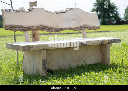 Solid bench made of solid wood invites you to rest Stock Photo