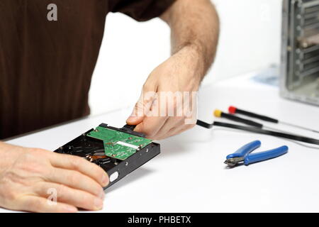 technician is repairing a computer Stock Photo