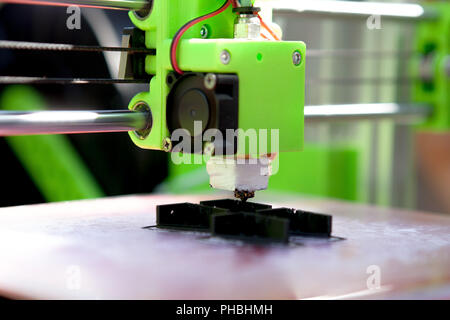 A desktop 3d printer in the laboratory for prints a structure from a polymer. Stock Photo