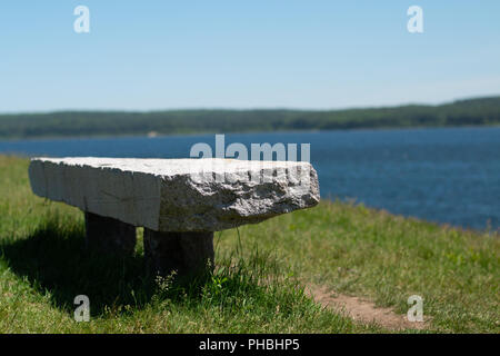 Stone bench taken at Wachusett Reservoir in Clinton, Massachusetts. Stock Photo