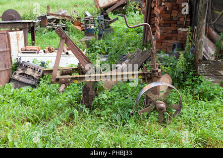 part of the old trailer and metal structures used in rural areas to work in agriculture, closeup Stock Photo