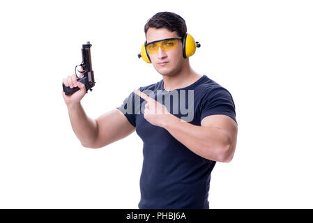 Man doing sport shooting from gun isolated on white Stock Photo