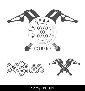 Bicycle Shop, Extreme Bikes Emblem. Crossed Rear Shock Absorbers, X Sign Made of Bicycle Chain. Monochrome Illustration. Extreme Typography. Stock Photo