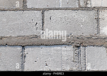 old gray wall made of gas silicate blocks connected by cement Stock Photo
