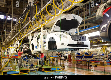 Workers assembler vehicles at Nissan Motor Co.'s plant in Tochigi, Japan on Thursday 12 Nov.  2009..  Photographer: Robert Gilhooly Stock Photo