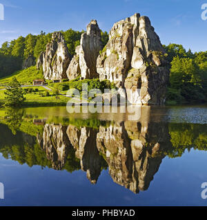 Externsteine, mirroring in a lake, Horn-Bad Meinberg, North Rhine-Westphalia, Germany, Europe Stock Photo