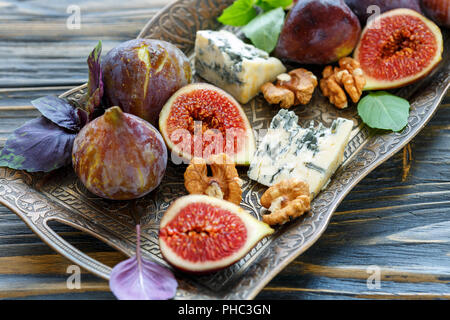 Ripe figs, blue cheese and walnuts. Stock Photo