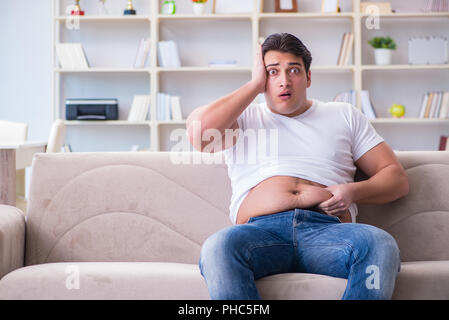 Man suffering from extra weight in diet concept Stock Photo