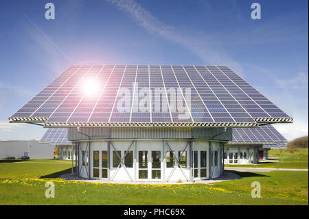 solar panels on roof with sun beams Stock Photo