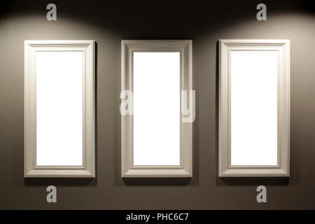 gallery interior, empty picture frames on the wall with lighting Stock Photo