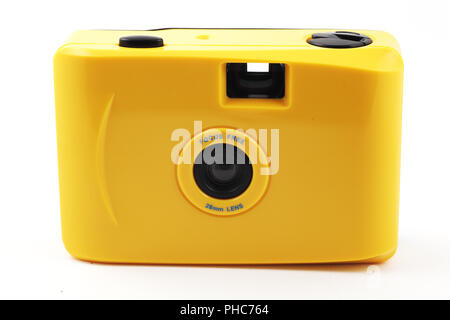 yellow camera shoot and go over white Stock Photo