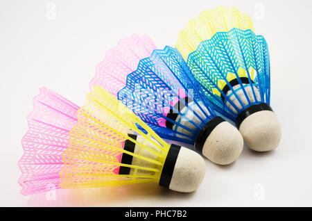 shuttlecocks in different colors on white Stock Photo