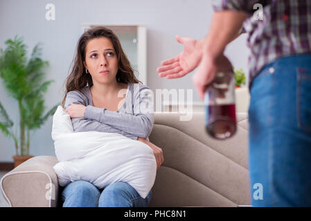 Domestic violence concept in a family argument with drunk alcoho Stock Photo