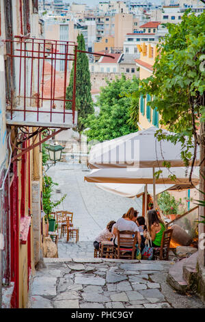 Cafes and tavernas on Mnisikleous Street in the Plaka district, Athens, Greece Stock Photo