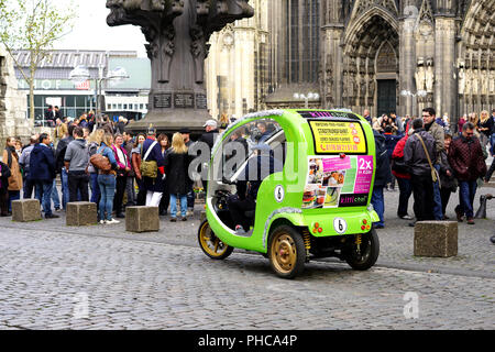 Rickshaw taxi at the cathedral in Cologne Stock Photo