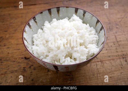 Traditional Japanese Koshihikari Rice as close-up in a bowl Stock Photo