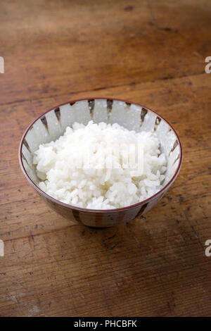 Traditional Japanese Koshihikari Rice as close-up in a bowl Stock Photo