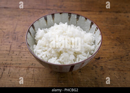 Traditional Japanese Koshihikari Rice as close-up in a bowl Stock Photo