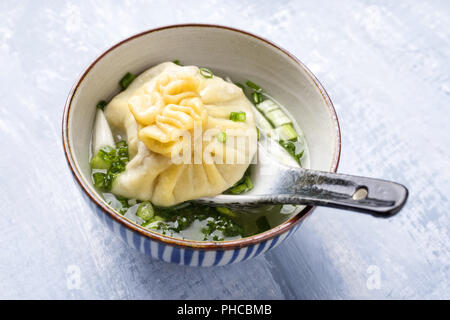 Traditional Caucasian Manti as close-up in a bowl Stock Photo