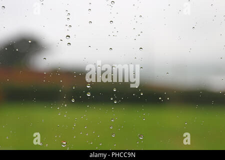 Raindrops on a window pane Stock Photo